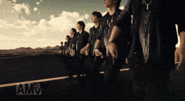a group of men standing next to each other with amv written on the bottom right