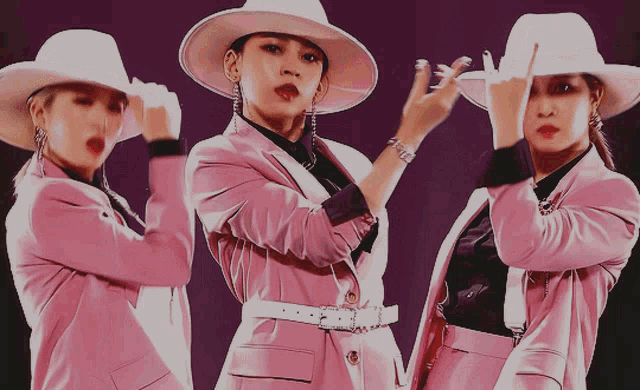 three women wearing pink suits and cowboy hats