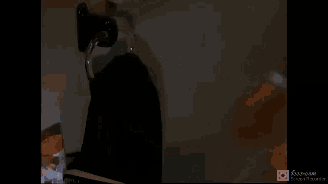 a man in a suit and tie is sweating in a screen recorder video
