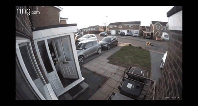a ring.com camera shows a person standing outside of a house