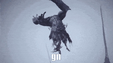 a monster is flying through the air with the word gn written on the bottom of it .