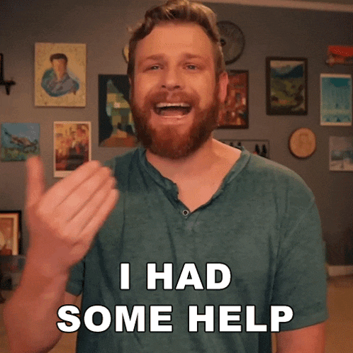 a man with a beard is giving a thumbs up and saying i had some help