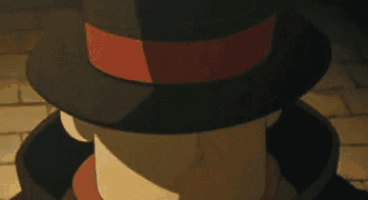 a close up of a cartoon character wearing a hat and a red ribbon .