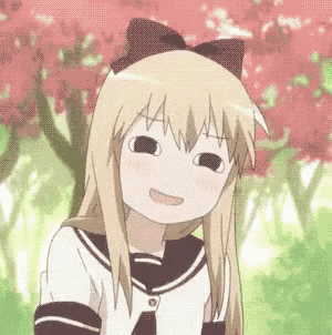 a girl with blonde hair and a bow on her head is smiling .