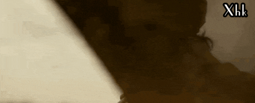 a close up of a person 's face with the letters xhl above it