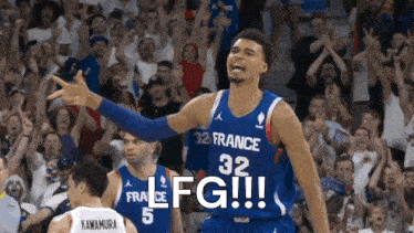 a basketball player with the number 32 on his jersey is celebrating