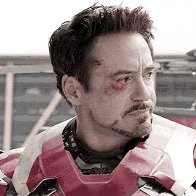 robert downey jr. is wearing a helmet and a beard .