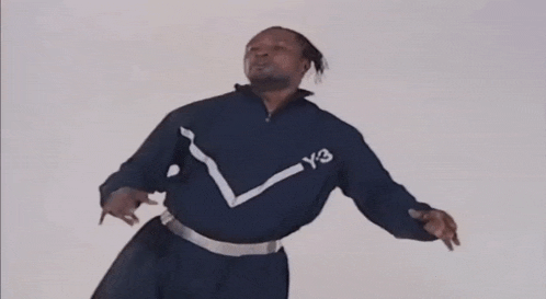a man wearing a blue jacket with y3 written on the front