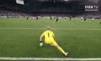 a soccer player wearing a yellow jersey with the number one on it