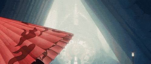 a red umbrella with chinese symbols on it is in a dark room