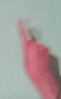 a person 's hand is making a middle finger sign