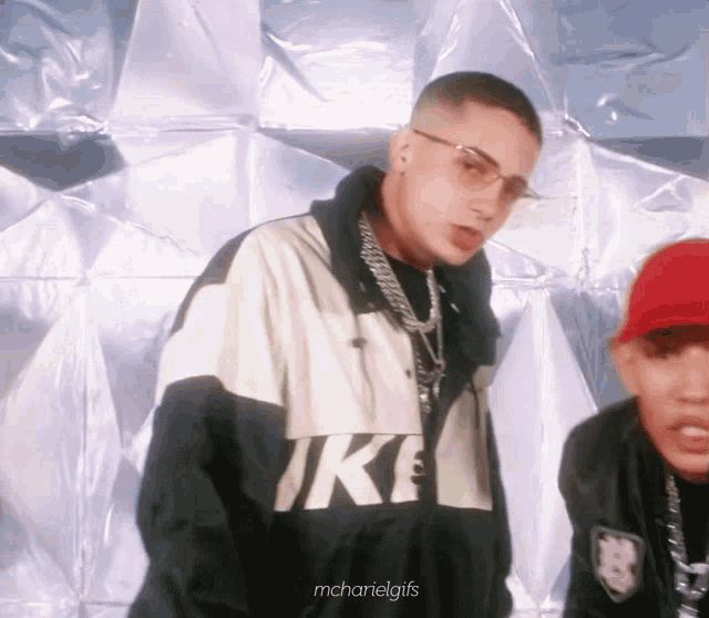 a man wearing a jacket that says nike on it