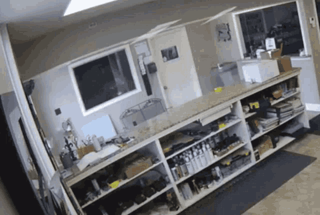 a room with lots of shelves and a sign that says ' a.m. ' on it