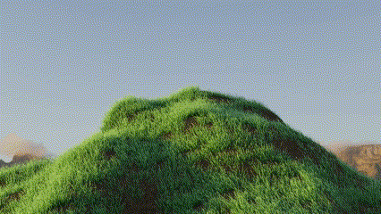 a hill covered in green grass with a blue sky in the background .