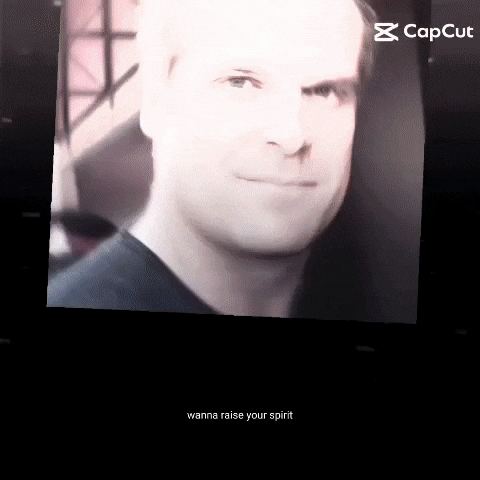 a close up of a man 's face with the words wanna raise your spirit below it