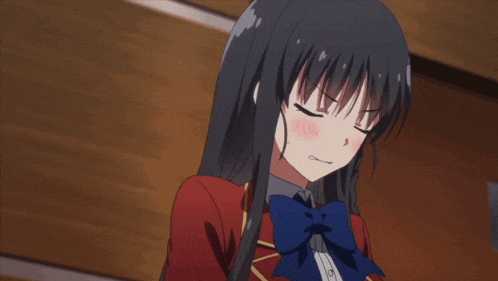 a girl with long black hair is wearing a red jacket and blue bow tie