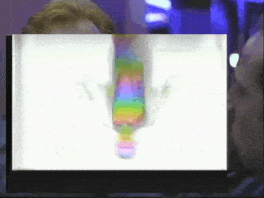 a rainbow colored object is being displayed on a white screen
