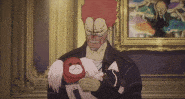a man with a skull mask holds a stuffed animal in front of a painting