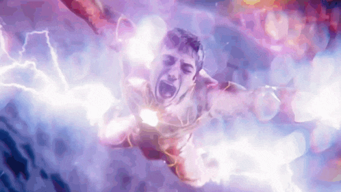 a man in a superhero costume is flying through the air with lightning coming from his chest .