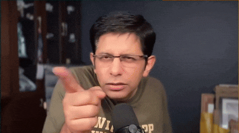 a man wearing glasses and a t-shirt that says ' n ' on it