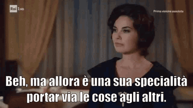 a tv screen shows a woman with the words beh ma allora e una sua specialita porter via le cose agli altri