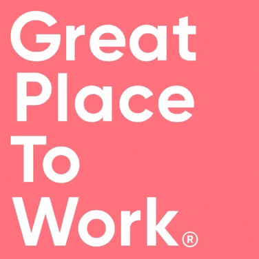 two women are posing for a picture with the words " vemat place to work "