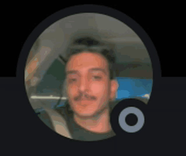 a blurry picture of a man with a mustache