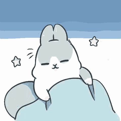 a cartoon rabbit is laying under a blue blanket with stars in the background .