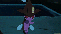 a group of purple monsters are standing on a sidewalk