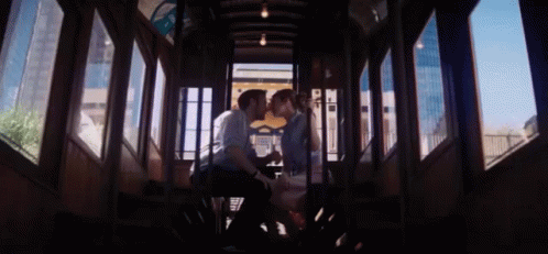 Kissing On The Trolley GIF - La La Land Emma Stone Ryan Gosling GIFs