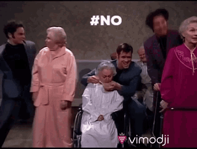 a group of people are standing around an elderly woman in a wheelchair with #no written on the screen