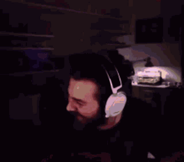 a blurry image of a man with a beard and sunglasses
