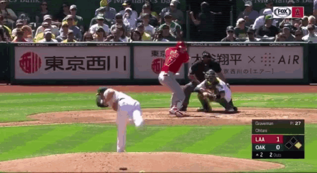 a baseball game is being played in front of a fox network ad