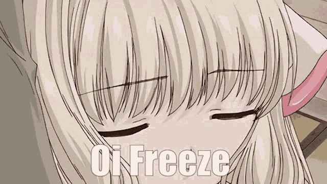 a close up of a blonde anime girl with her eyes closed and the words `` oi freeze '' written above her .