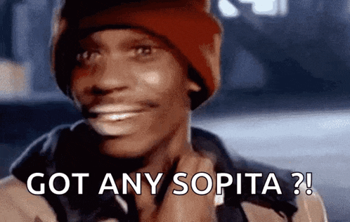 a man wearing a red beanie is smiling and saying got any sopita ?