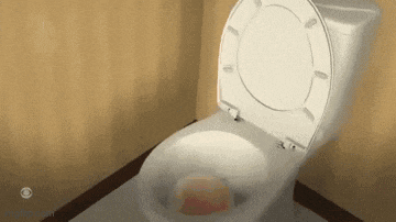 a toilet with the lid open and a soap bar in it .