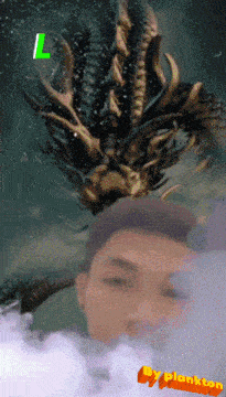 a picture of a man with a dragon behind him and the words by plankton