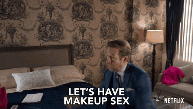a man in a suit says let 's have makeup sex in front of a bed