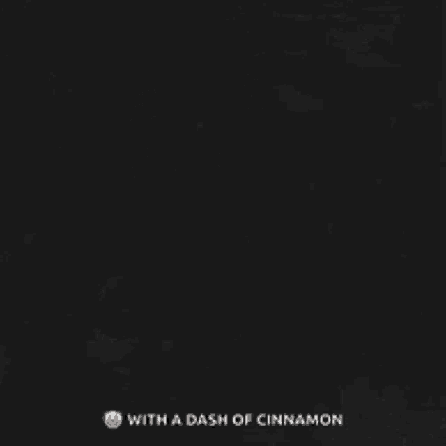a black background with the words good morning with a dash of cinnamon and a cup of coffee