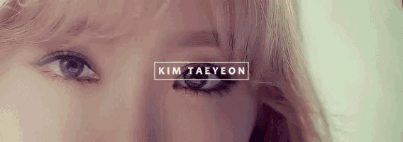 a close up of a woman 's eyes with the name kim taeyeon written in a box .