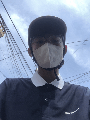 a man wearing a helmet and a mask has a shirt that says yody sport on it