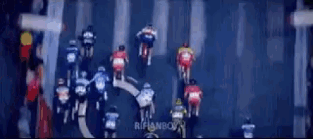 a group of people are riding motorcycles down a road .