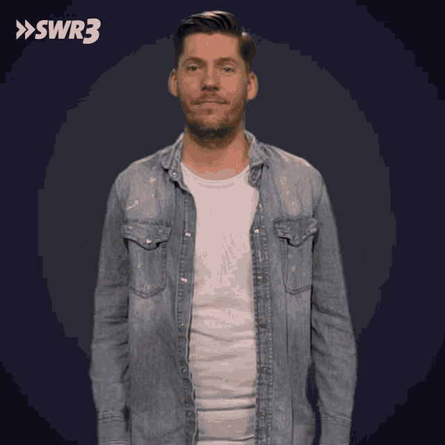 a man in a denim shirt is standing in front of a blue background with swr3 written on it