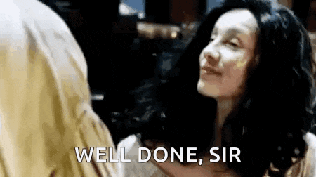 a woman is hugging a man and says `` well done sir '' .