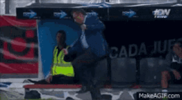a soccer player is laying on a stretcher in the dugout