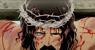 jesus is wearing a crown of thorns on his head while hanging on the cross .