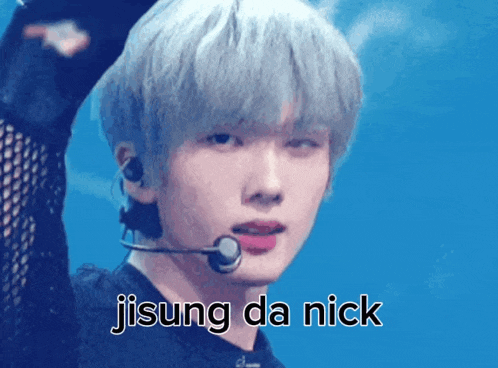 a young man with a microphone and the words jisung da nick written on the bottom