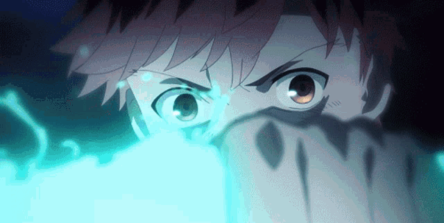 a close up of a person 's eyes with a blue light behind them