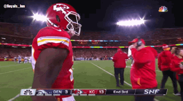 a football game is being played and the score is 13 to 3