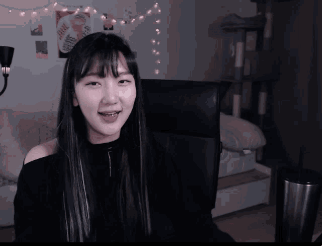 a girl sitting in a chair with her mouth open